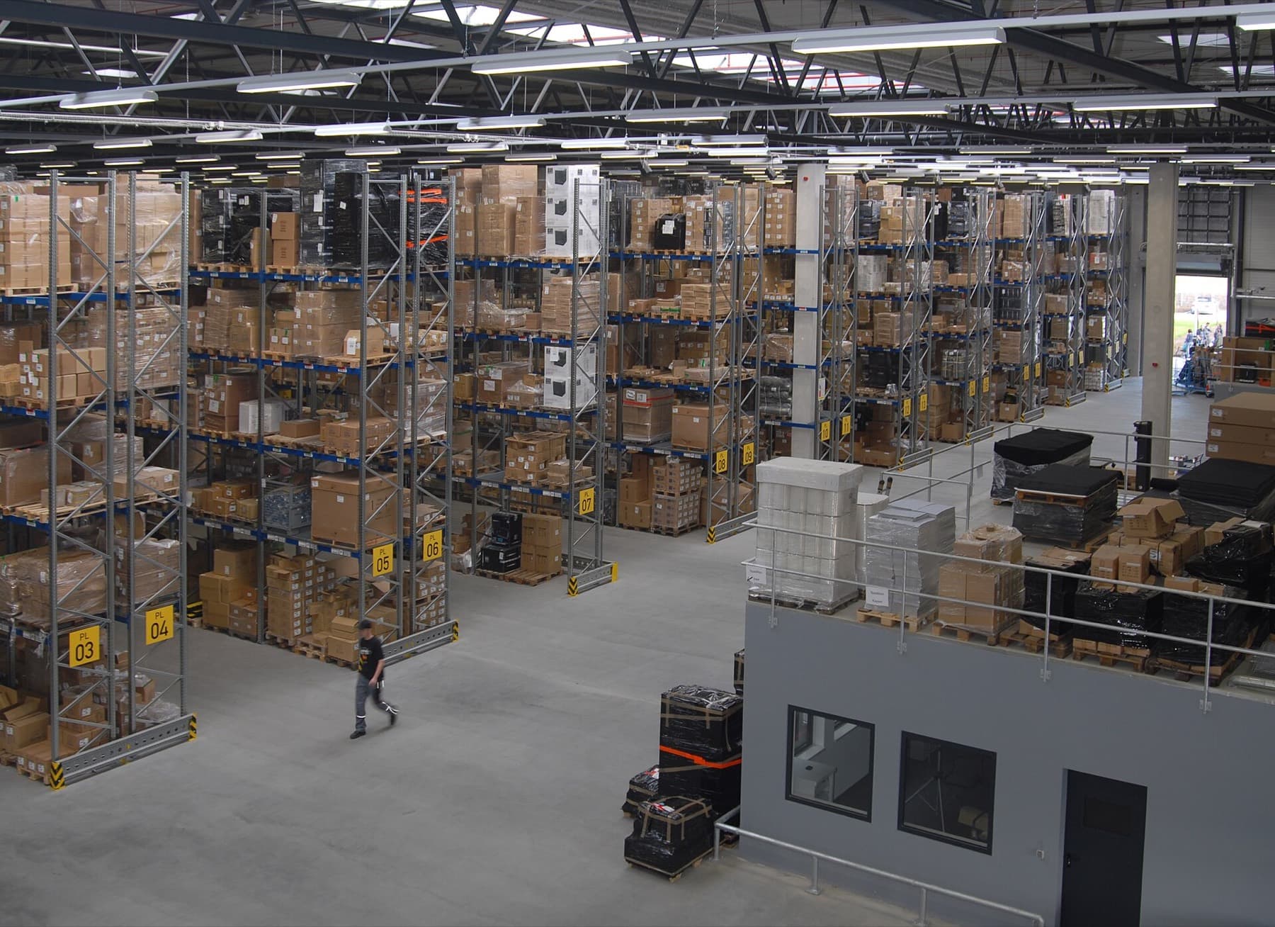 Warehouse aisles with stacked inventory